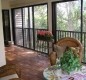 [Image: Mariner Sands Condo-Hardwood Floors Enclosed Porch Overlooking Garden.]