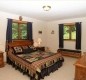 [Image: Two Stories of Comfort-15 Acres of Privacy. No Wonder the Eagle Landed Here!]