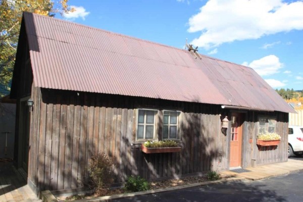 [Image: New Listing! Historic Cabin! Two Blocks to Main St. Walk to Everything!]