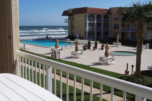 [Image: Oceanfront Condominium Complex]