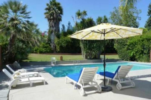 [Image: Large House with Swimming Pool in a Quiet Area]