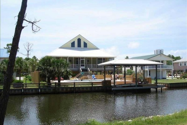 [Image: 'Sea-Schell' Waterfront Home with Heated Pool]