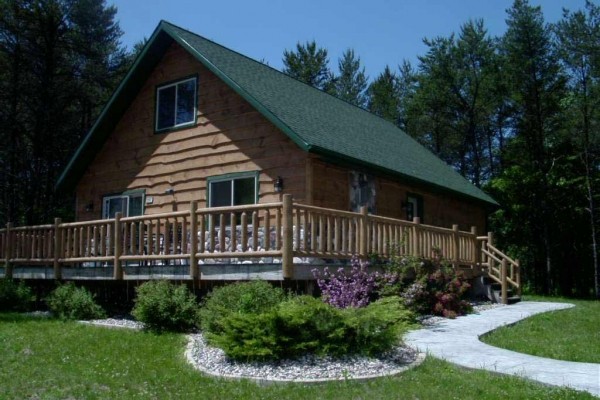 [Image: The 6 Bedroom Log Home is Located at Springbrook Resort in Wisconsin Dells]