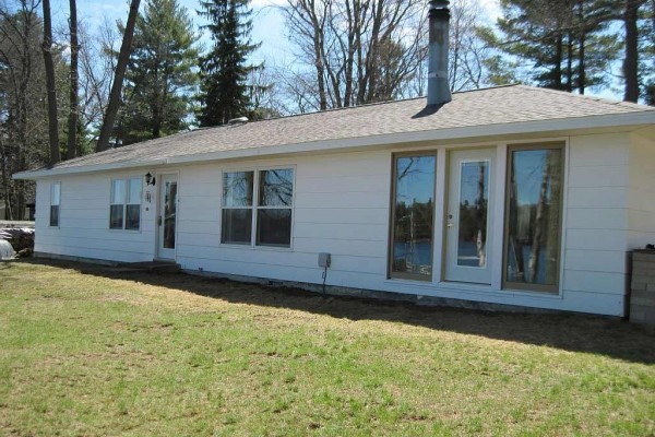 [Image: Step Out the Door and You Have Arrived. Water Level Lot with Room to Enjoy.]