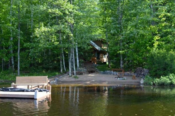 [Image: Rustic Wooded Lake Seclusion in a Cozy Log Cabin]