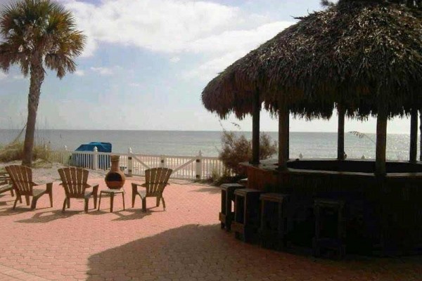[Image: Gulf Front Beach House - Backyard Beach with Tiki Bar &amp; Cabana]